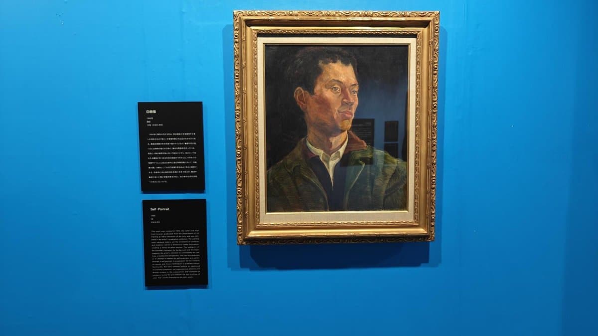 Framed portrait on blue wall