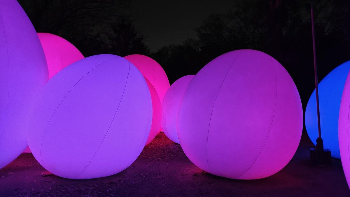 Glowing colorful orbs at night