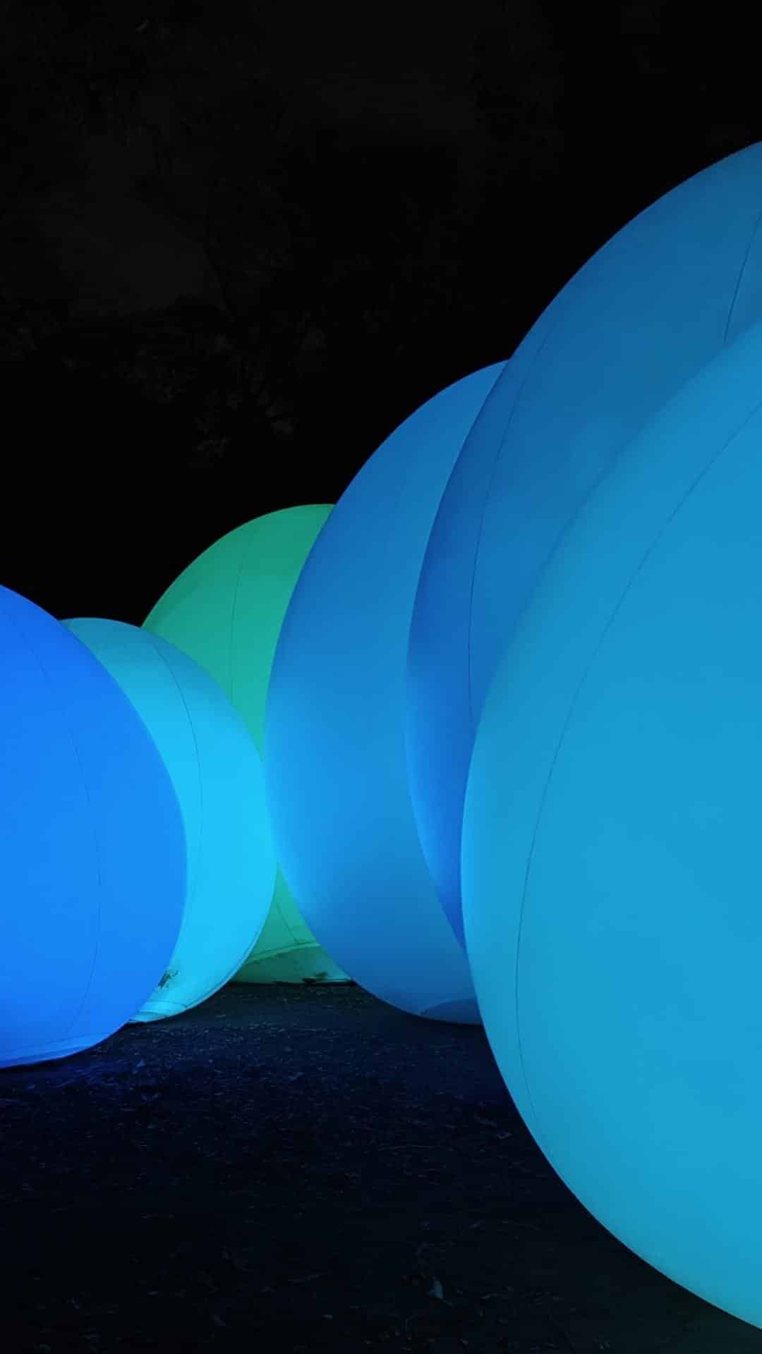 Glowing spheres in vibrant blues