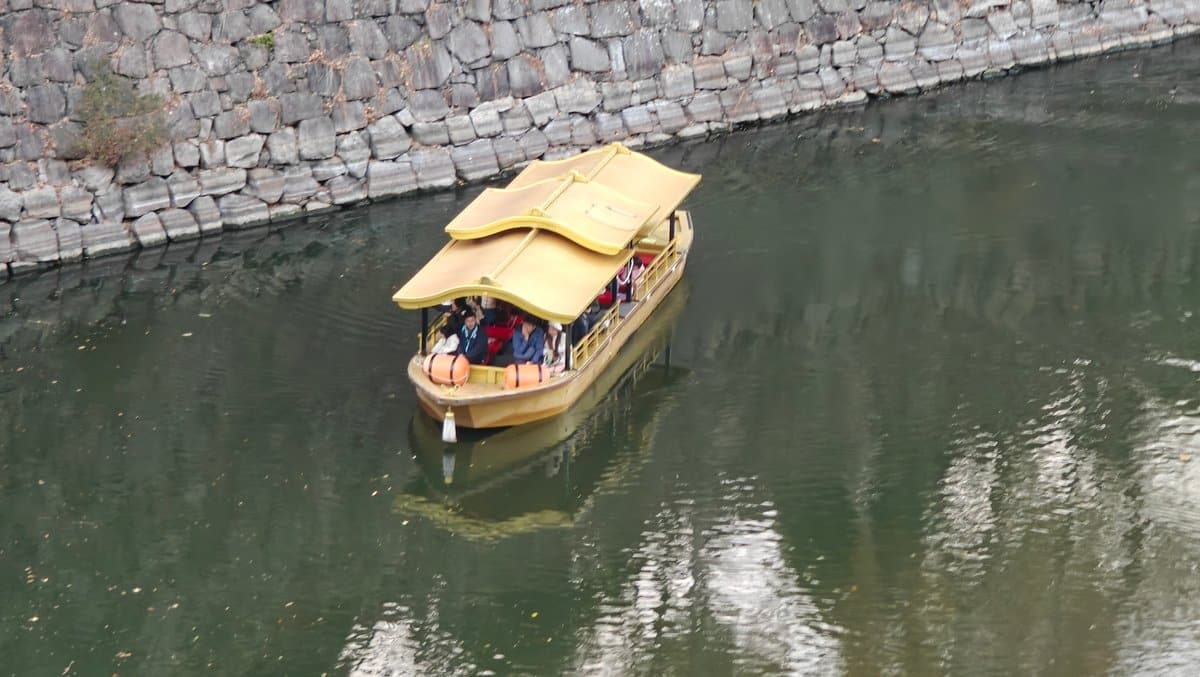 Gold-roofed tour boat on moat
