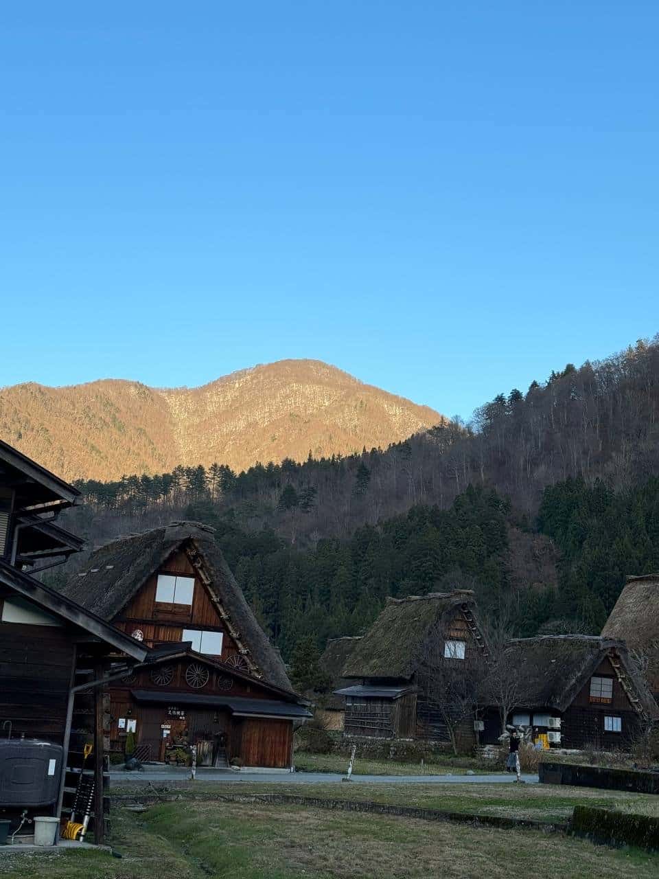 Golden hour mountain slope houses