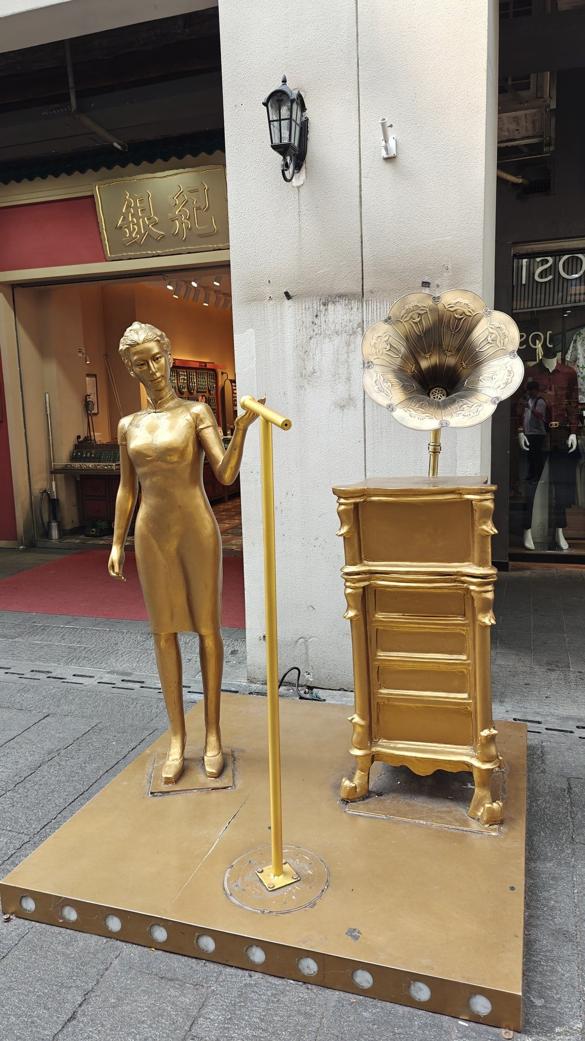 Golden woman gramophone statue