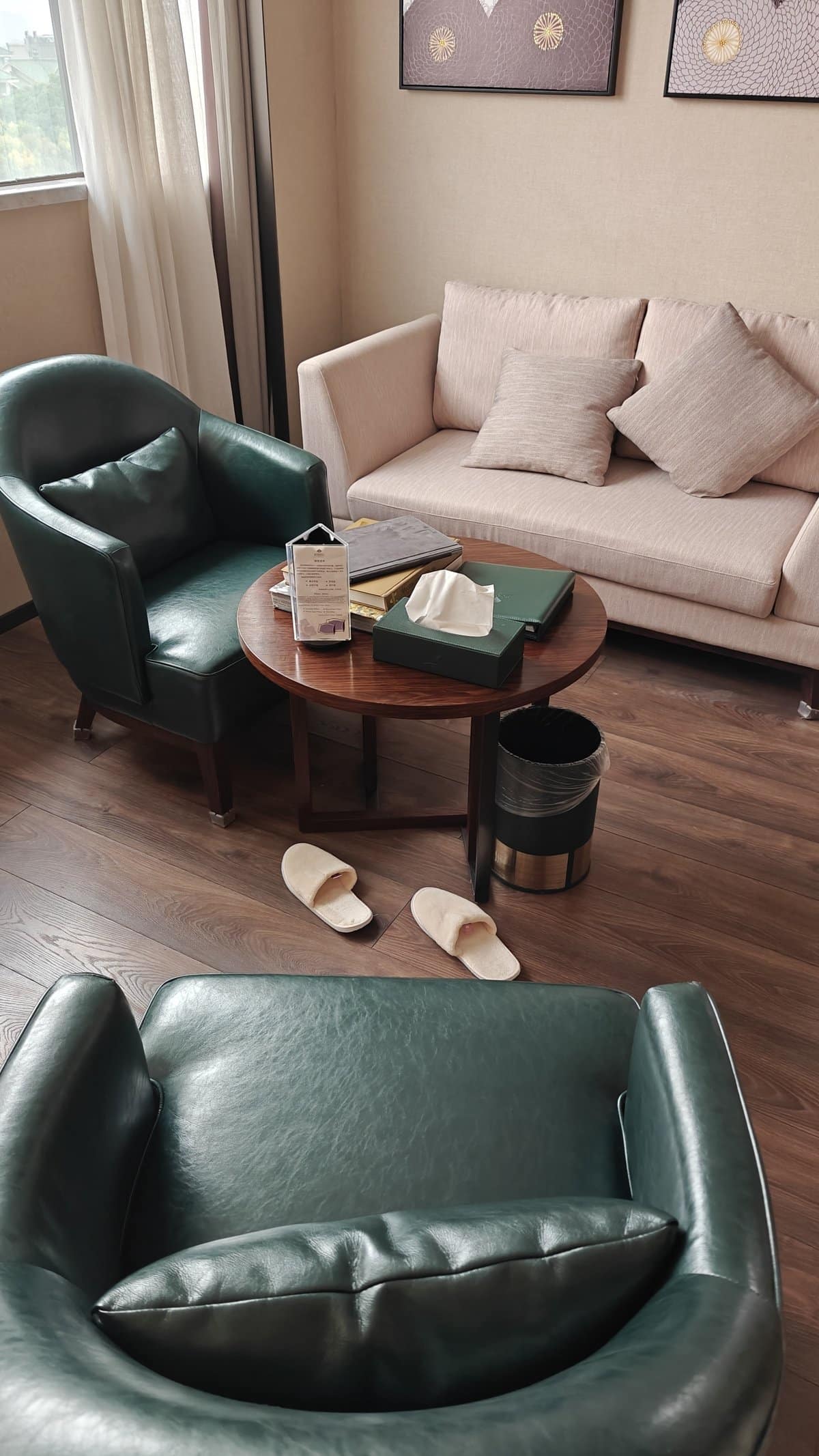 Green leather chairs seating area