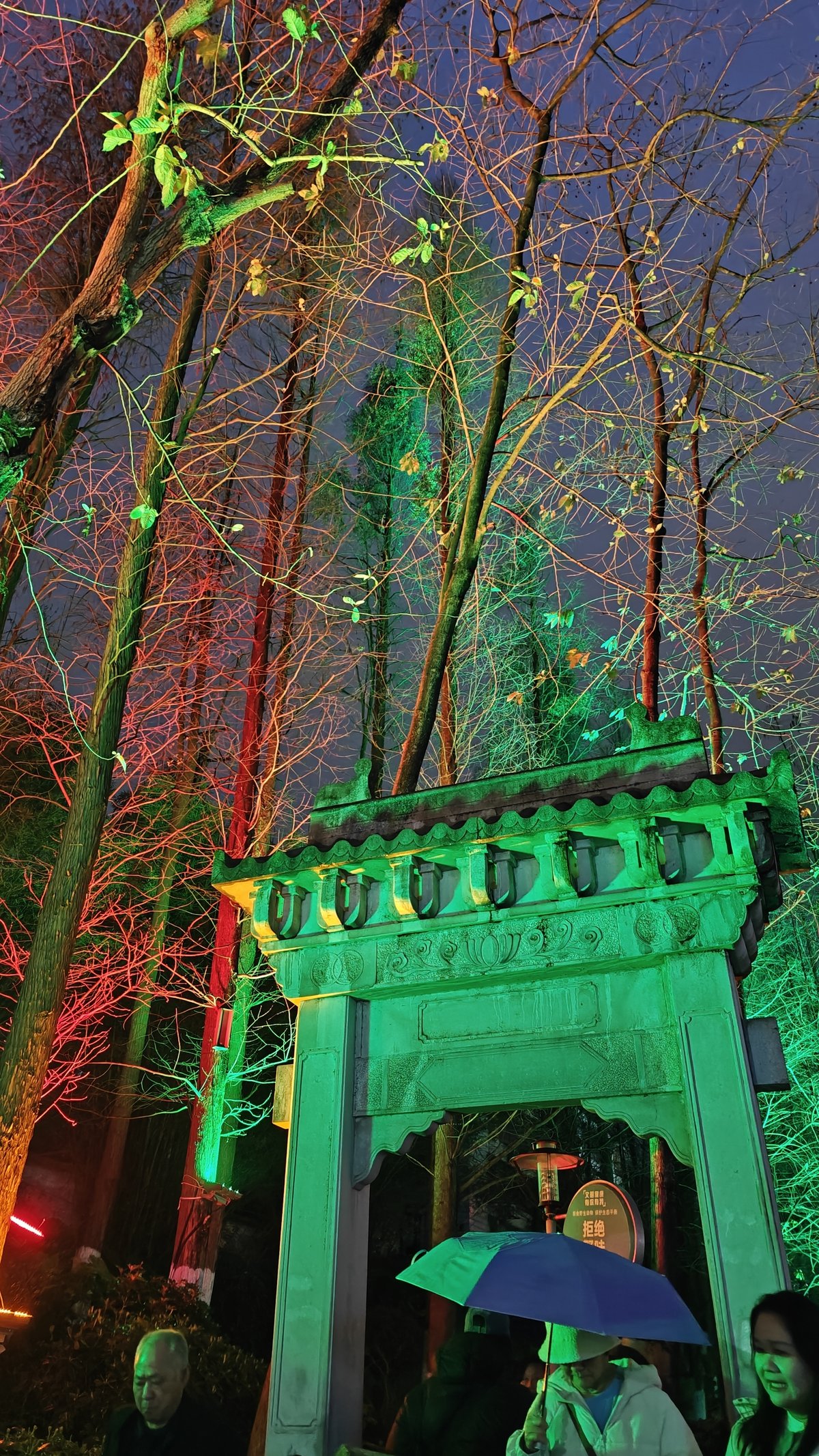 Green-lit stone archway gate
