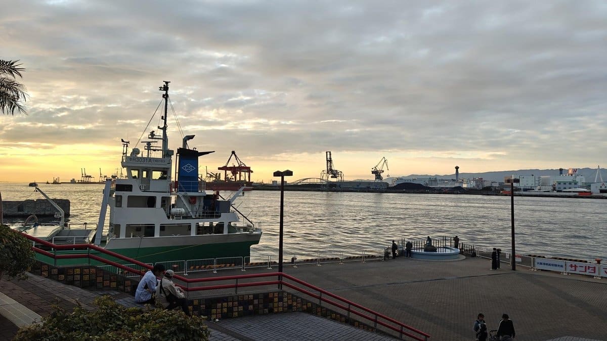 Harbor scene at sunset with a boat