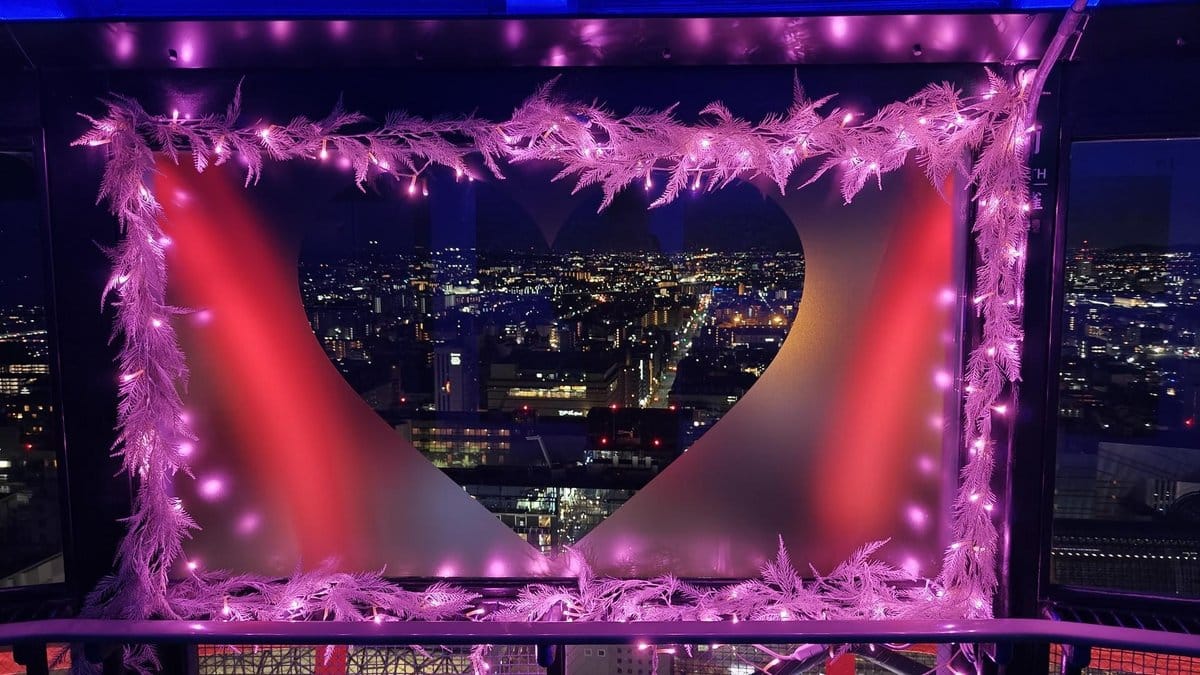 Heart-shaped city view with pink lights
