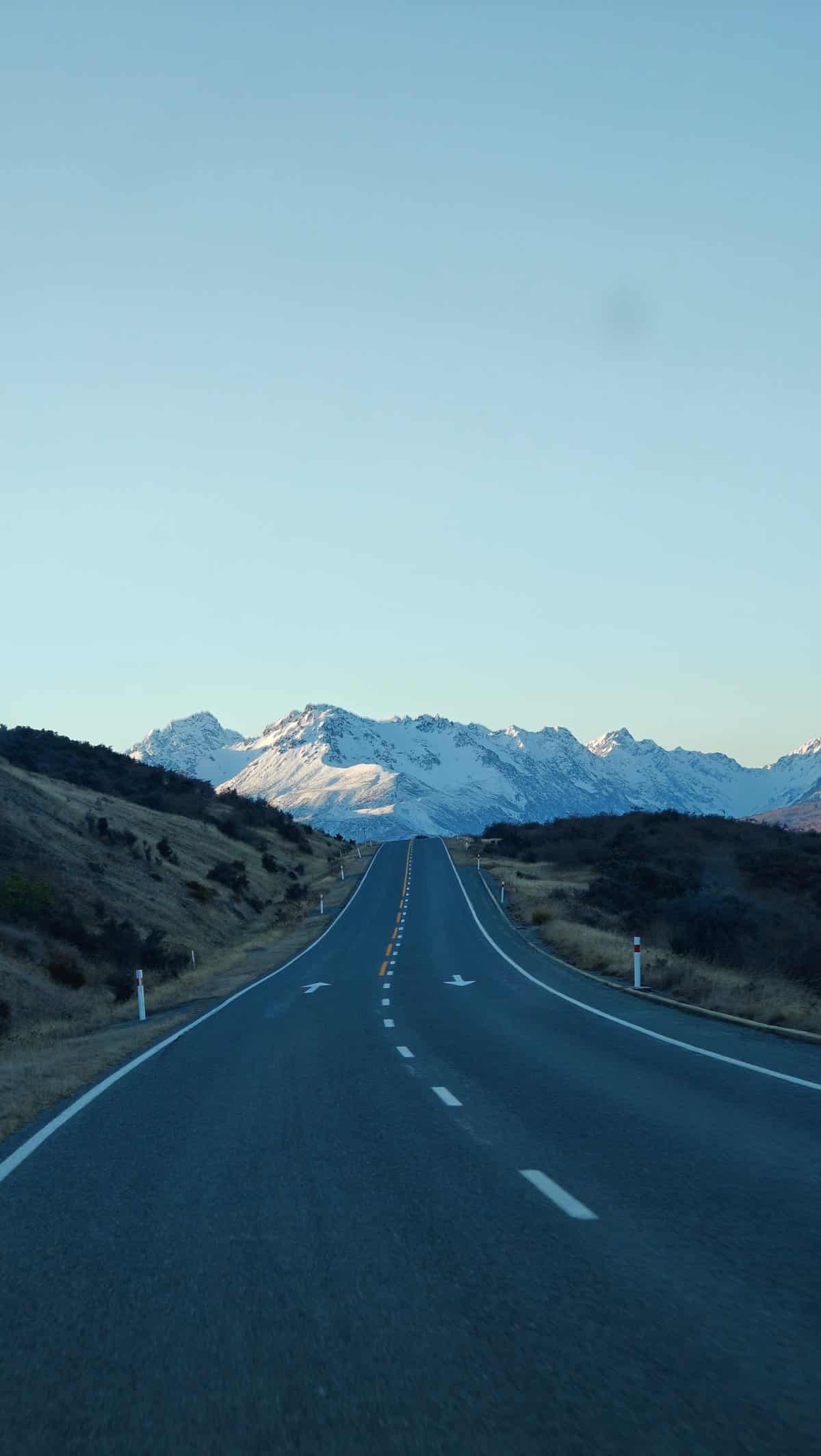 Highway straight to snow mountains