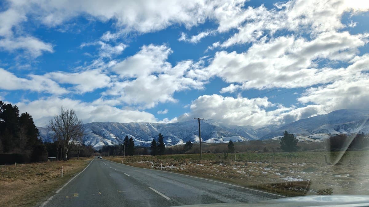 Highway toward snow mountains