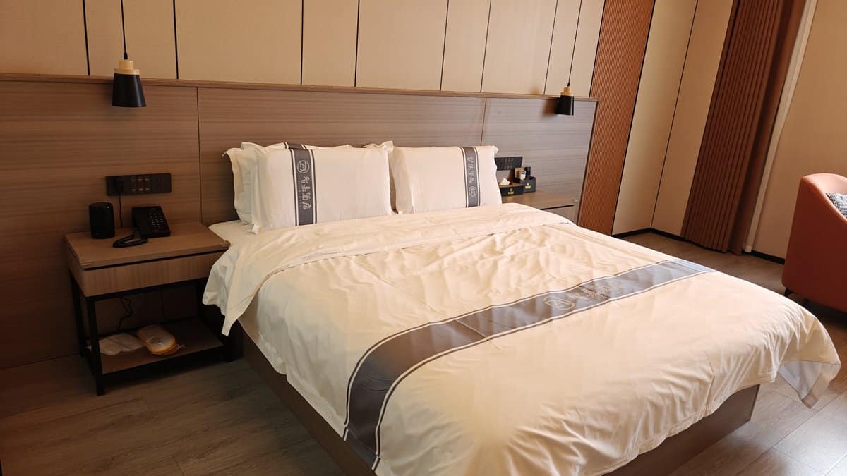 Hotel bed white linens