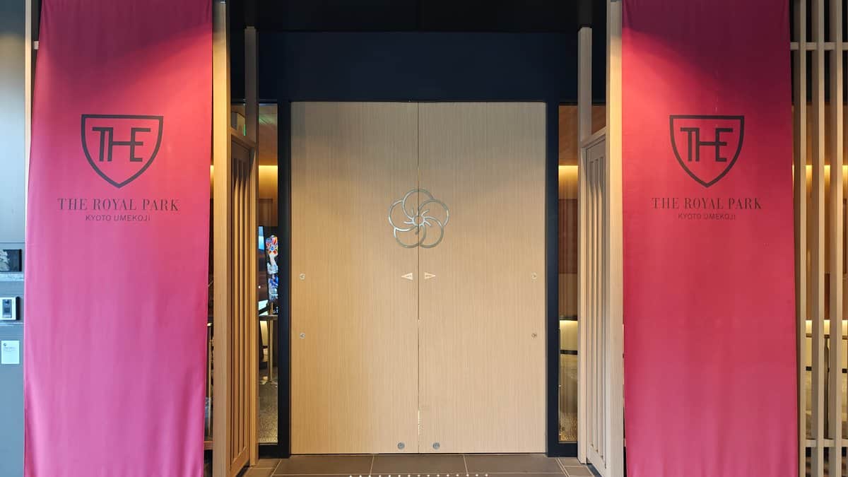 Hotel entrance doorway with the 'THE' emblem and