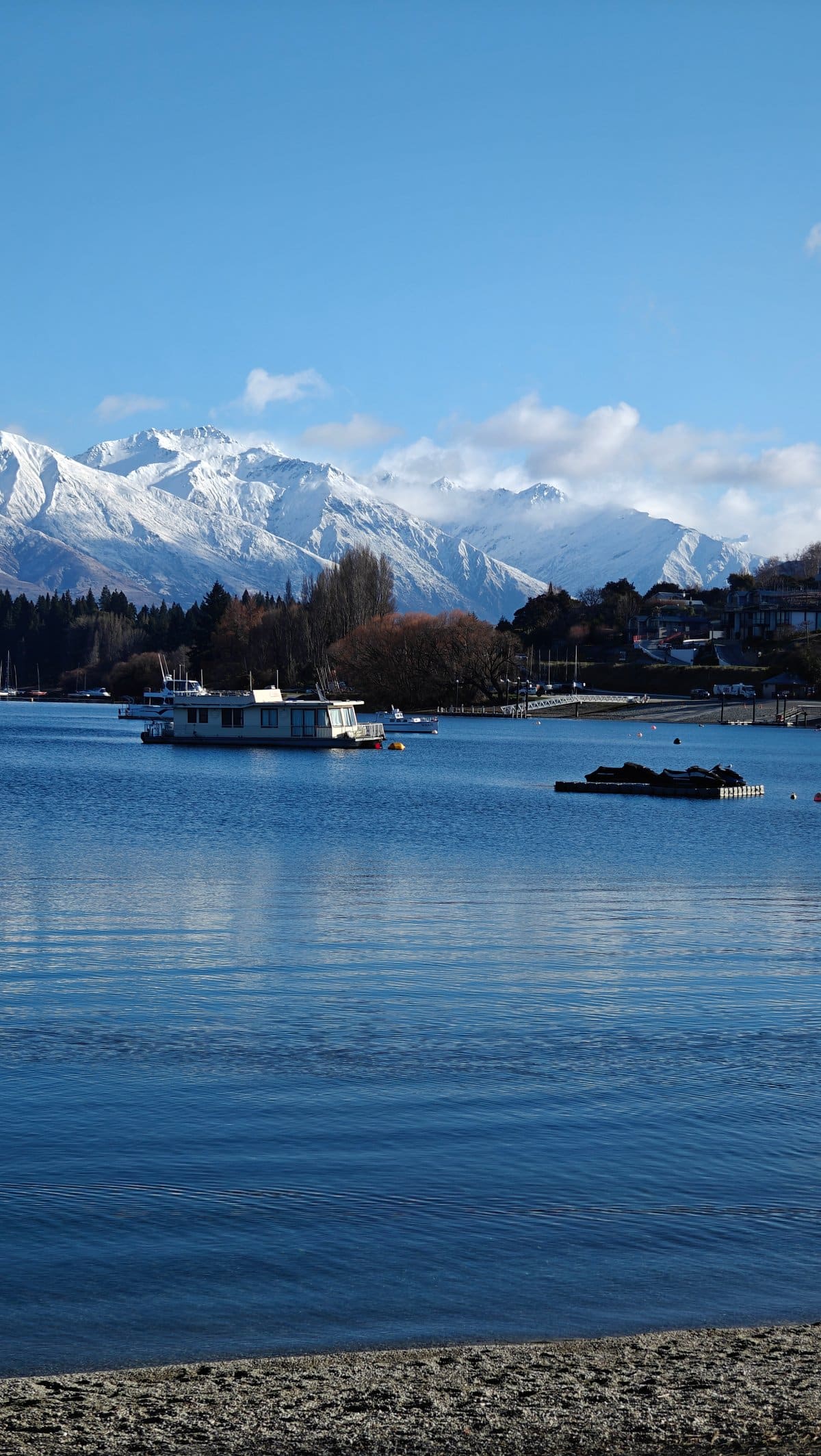Houseboat on mirror-calm Lake Wanaka