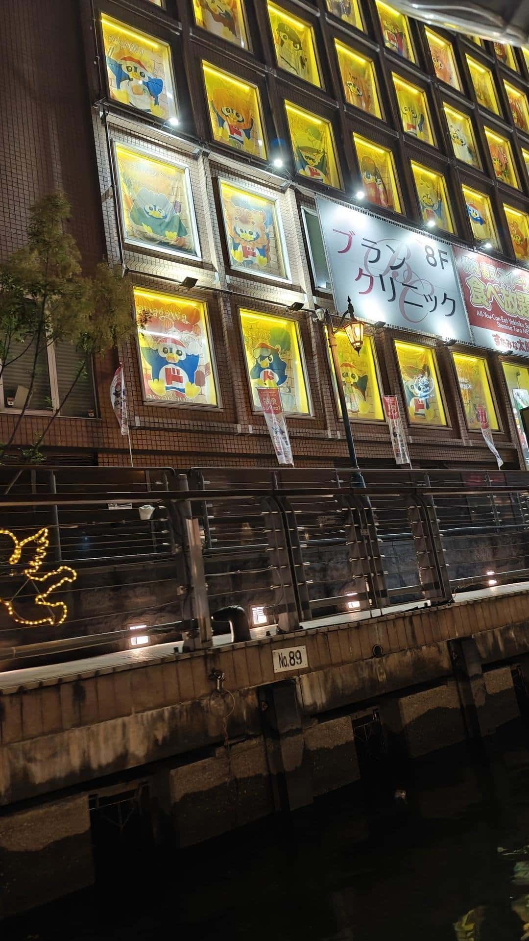 Illuminated building with colorful murals