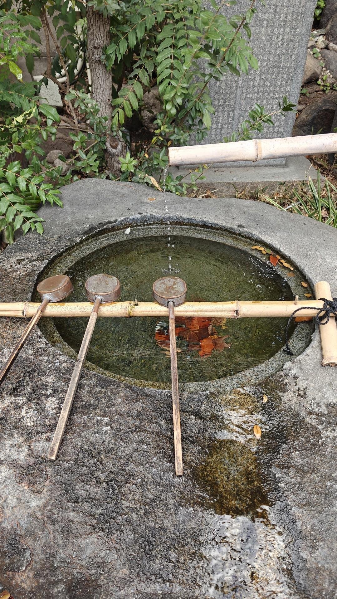 Japanese stone water basin with ladles