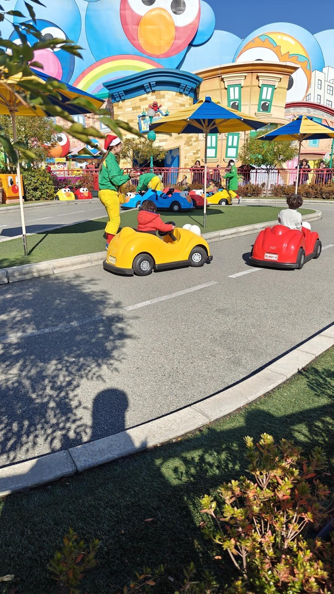 Kids driving colorful toy cars