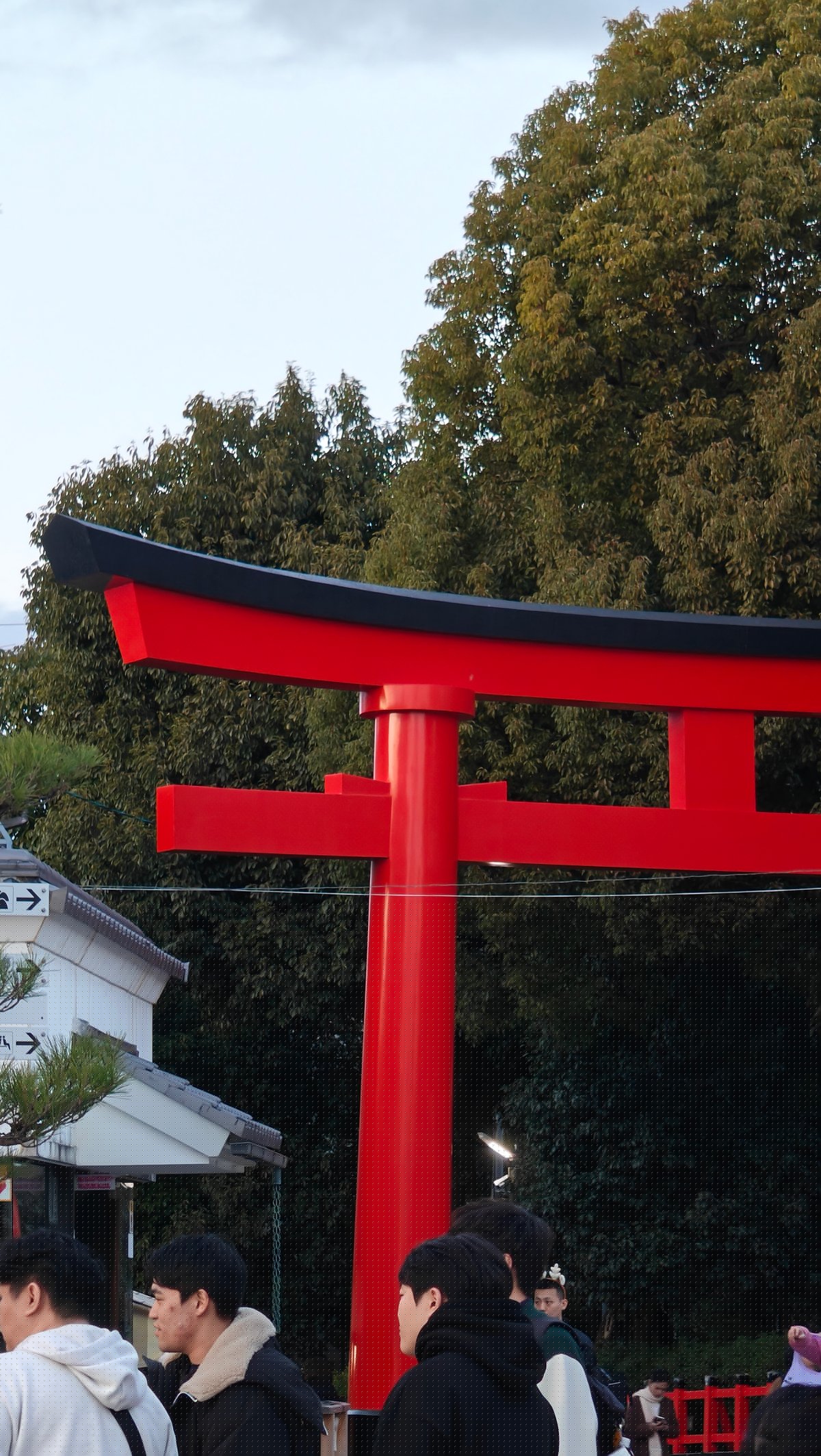 Large torii with event tents beneath an evening