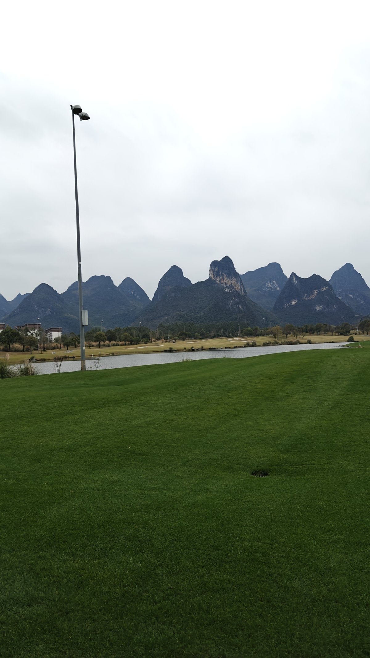 Lawn leading to dramatic peak