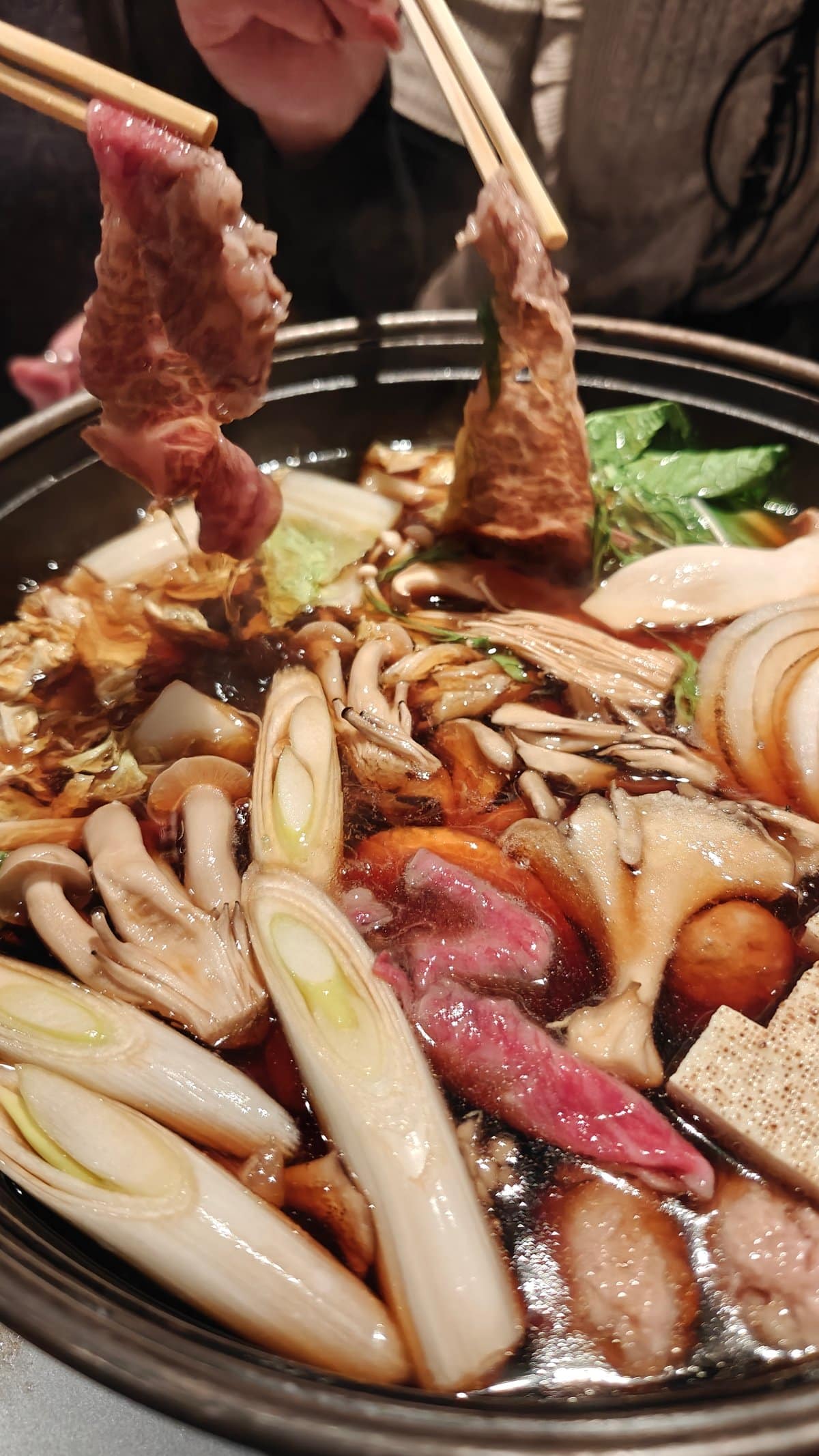 Lifting wagyu from hot pot