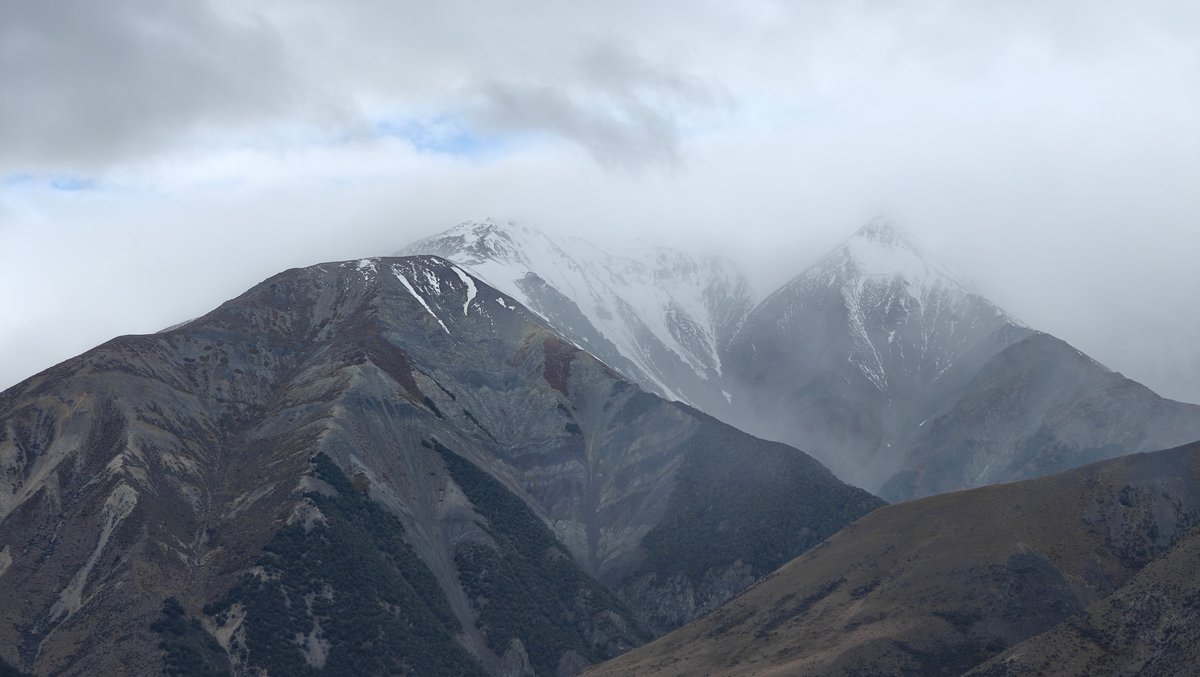 Misty snow-streaked mountains
