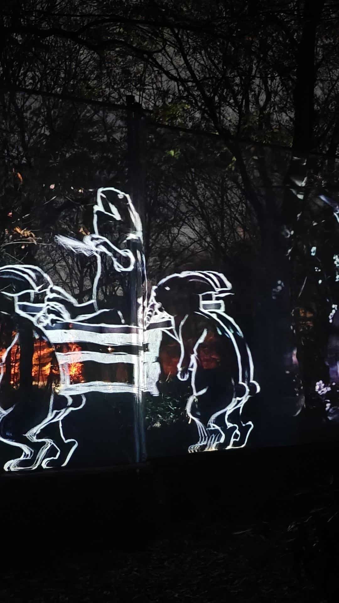 Neon rabbits in forest light display