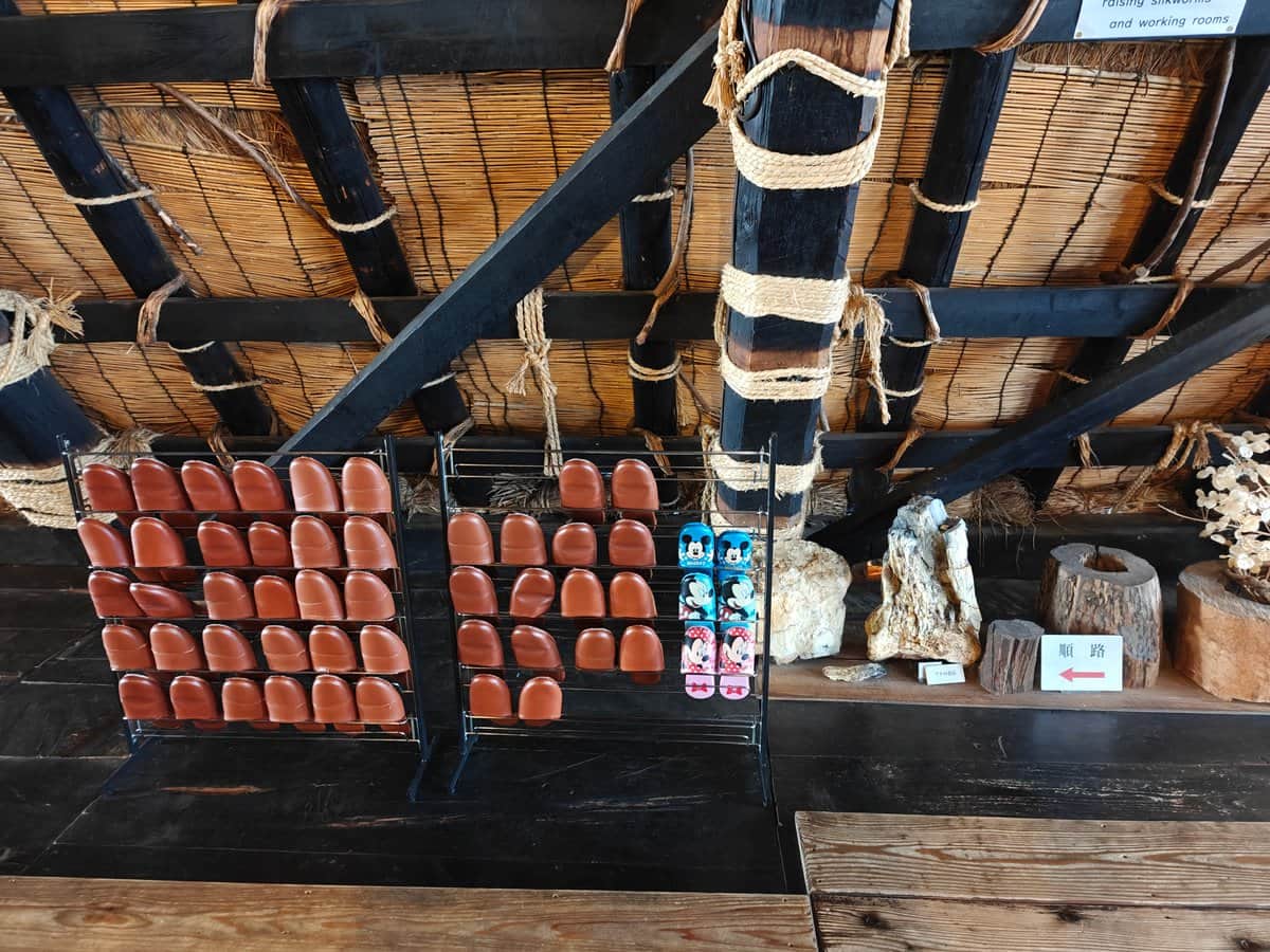 On the upper (silkworm) floor: wire racks of