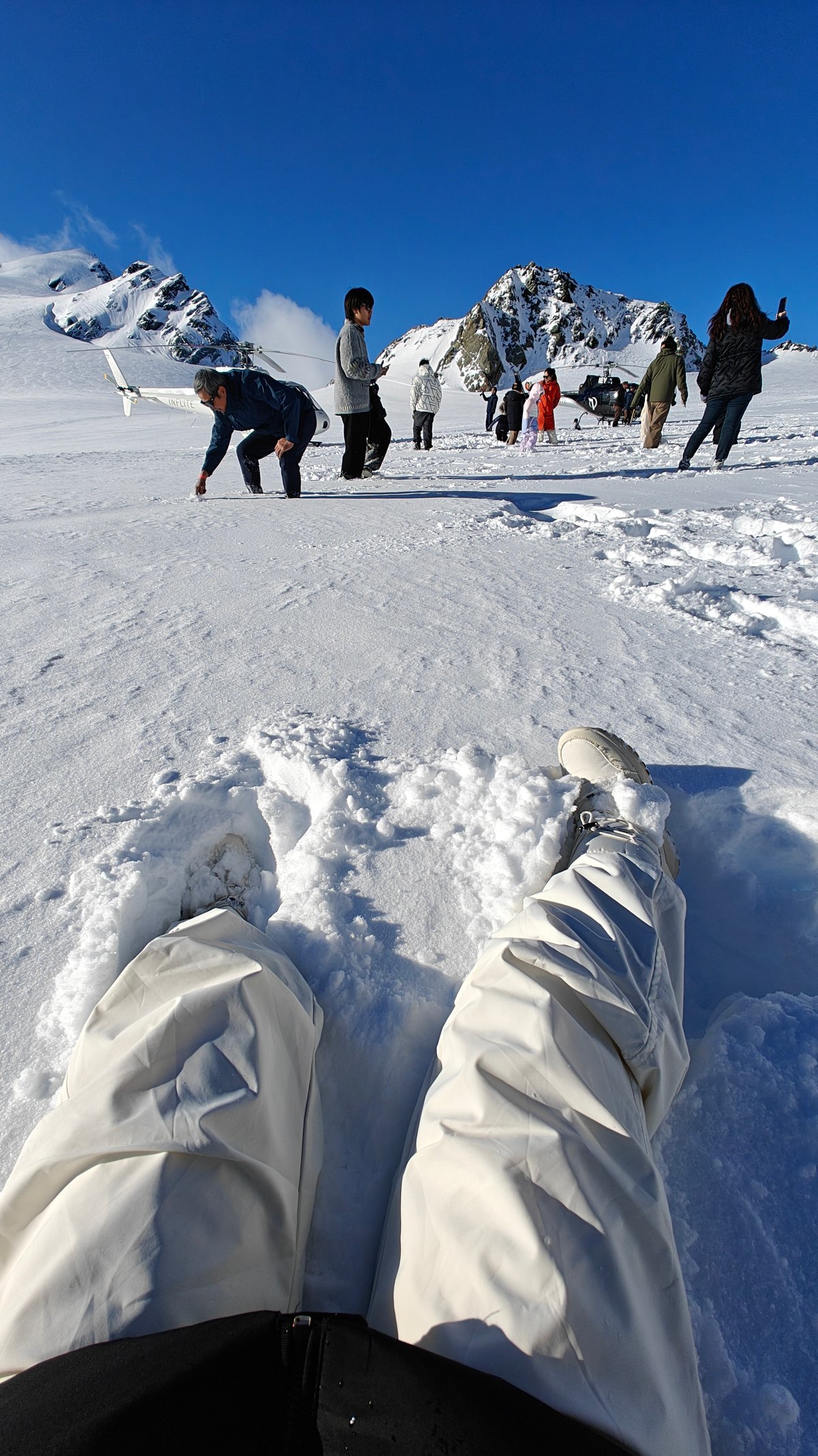 Passengers on glacier snow