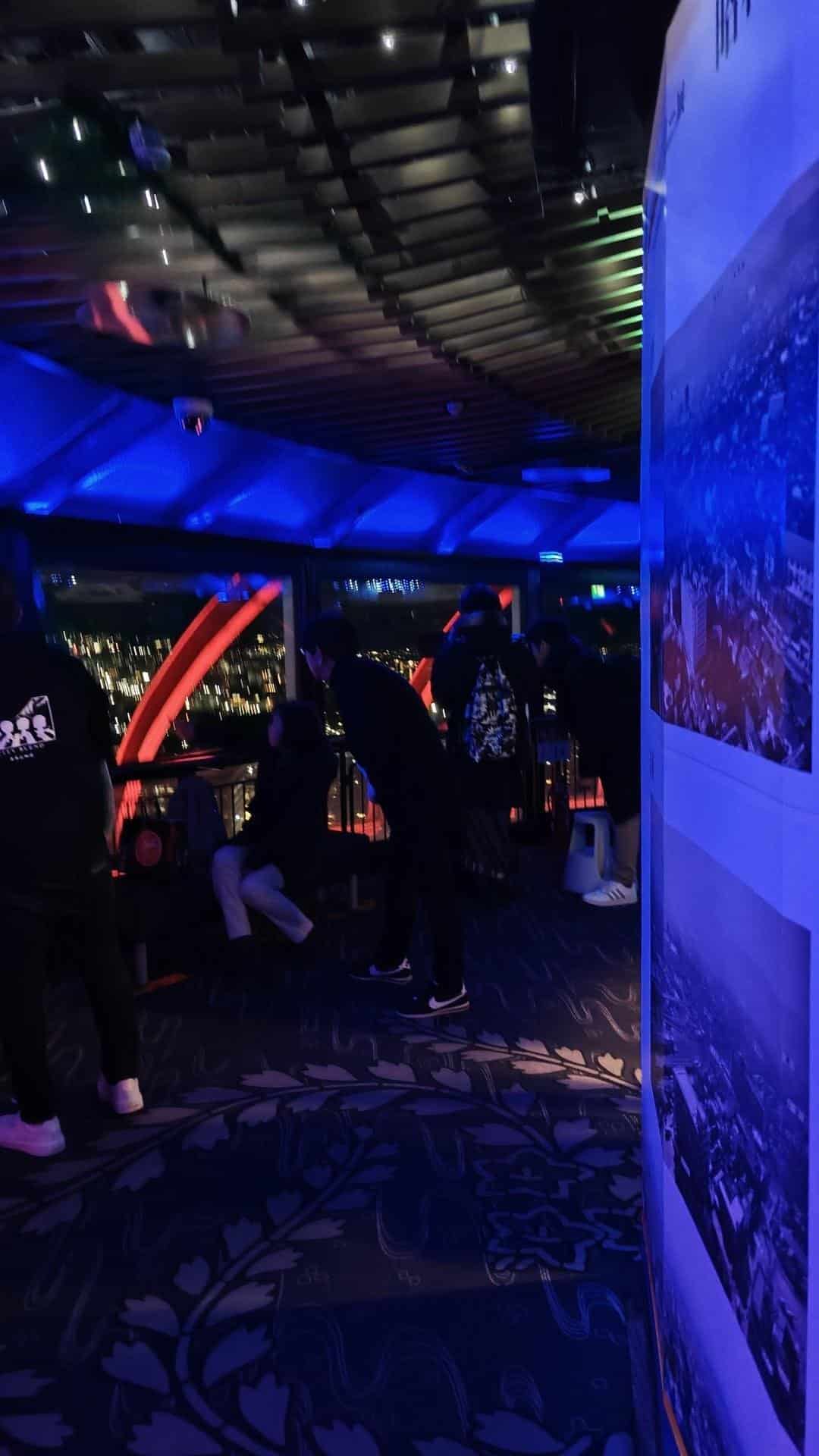 People enjoying city view indoors