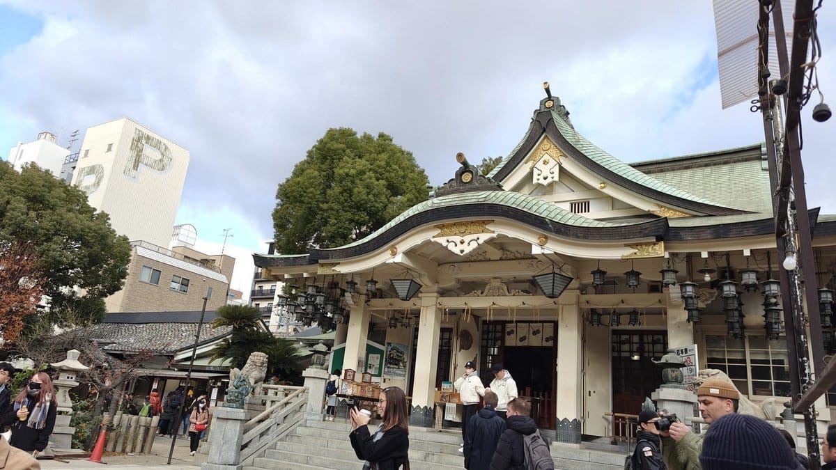 People outside a traditional temple