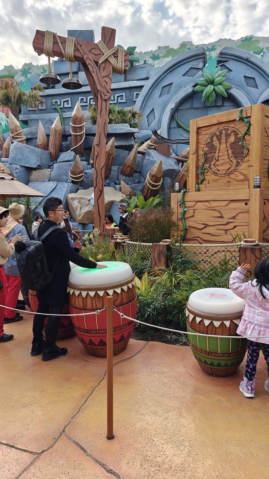 People playing drums at themed area