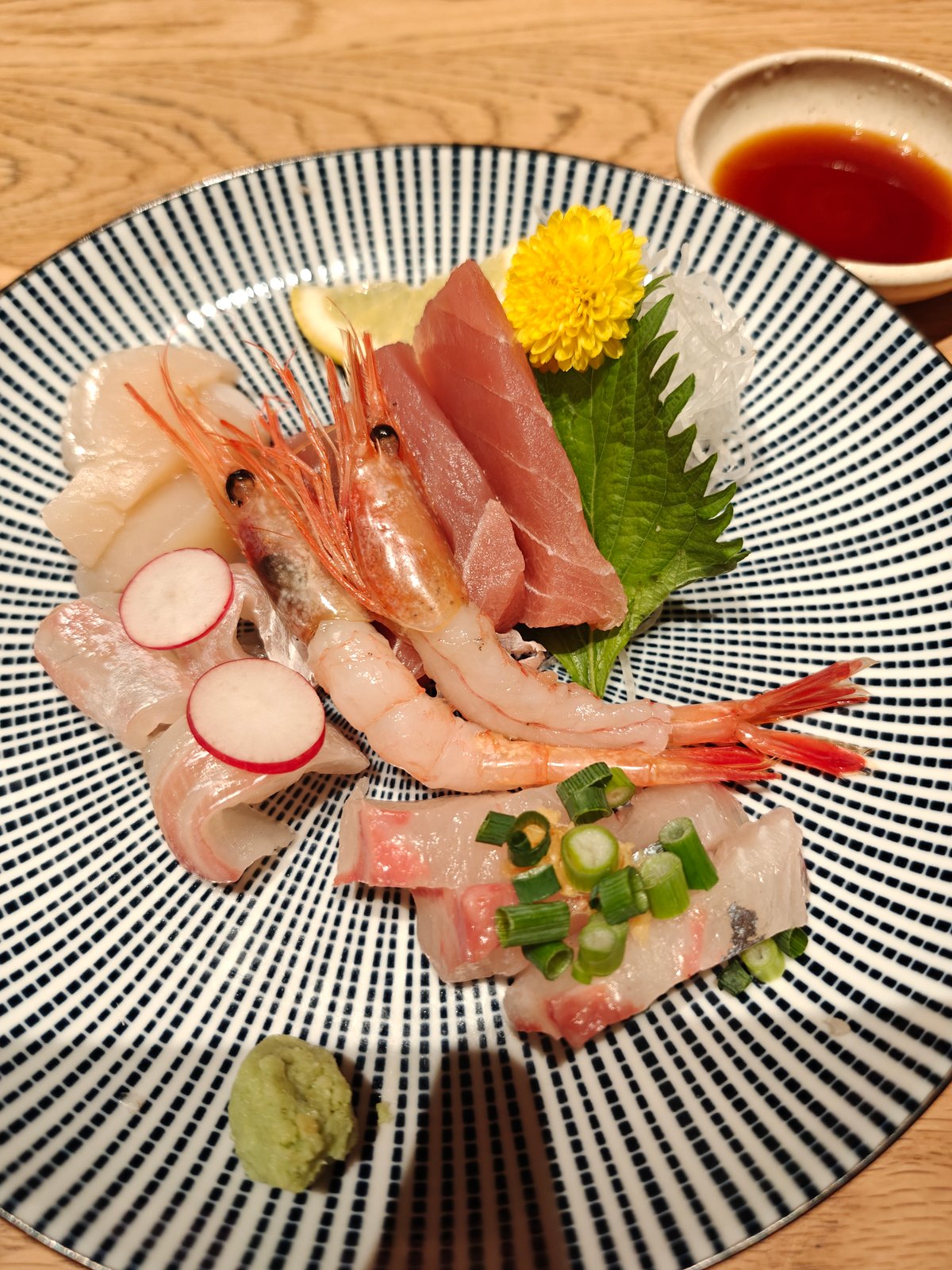 Plate of assorted sashimi - shrimp, sliced white