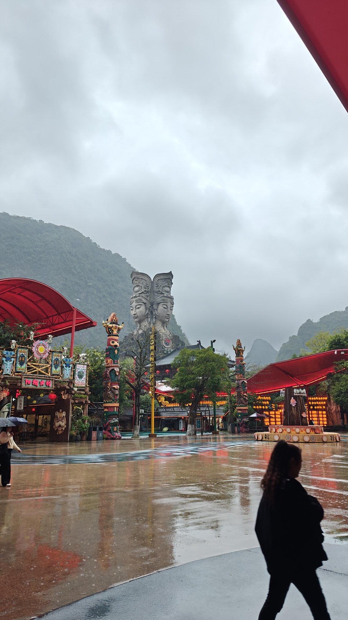Plaza with statue and totems