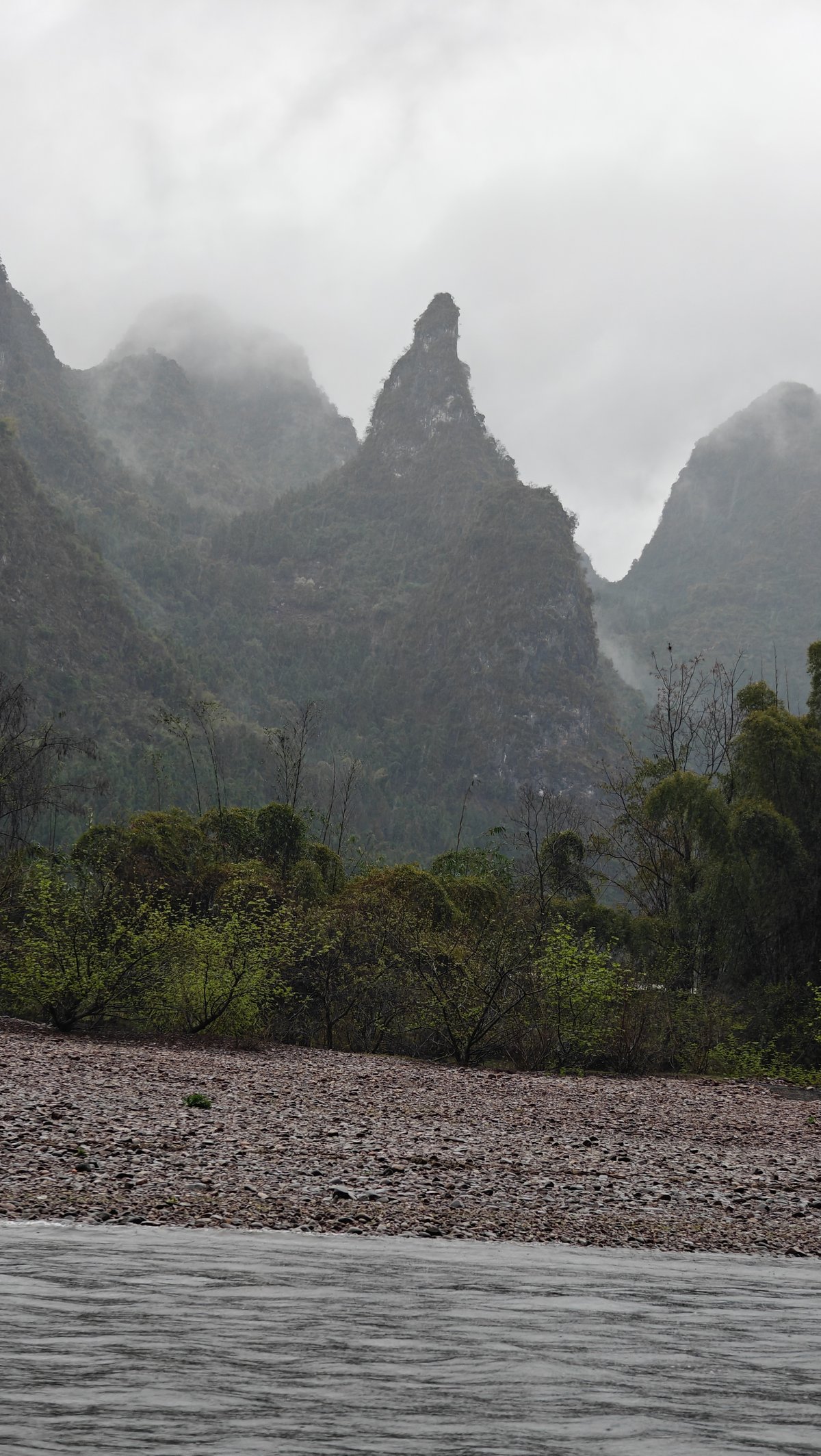 Pointed misty karst spire silhouette