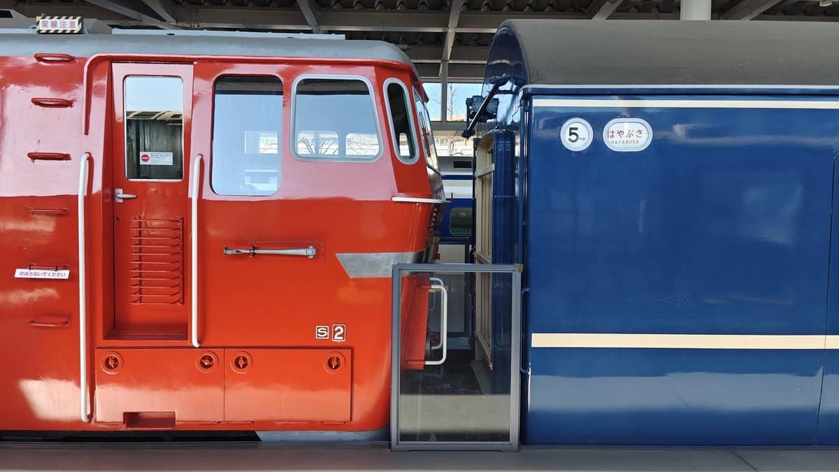 Red and blue train cars side by side