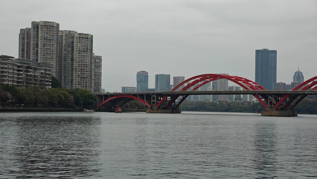 Red bridge city skyline boat