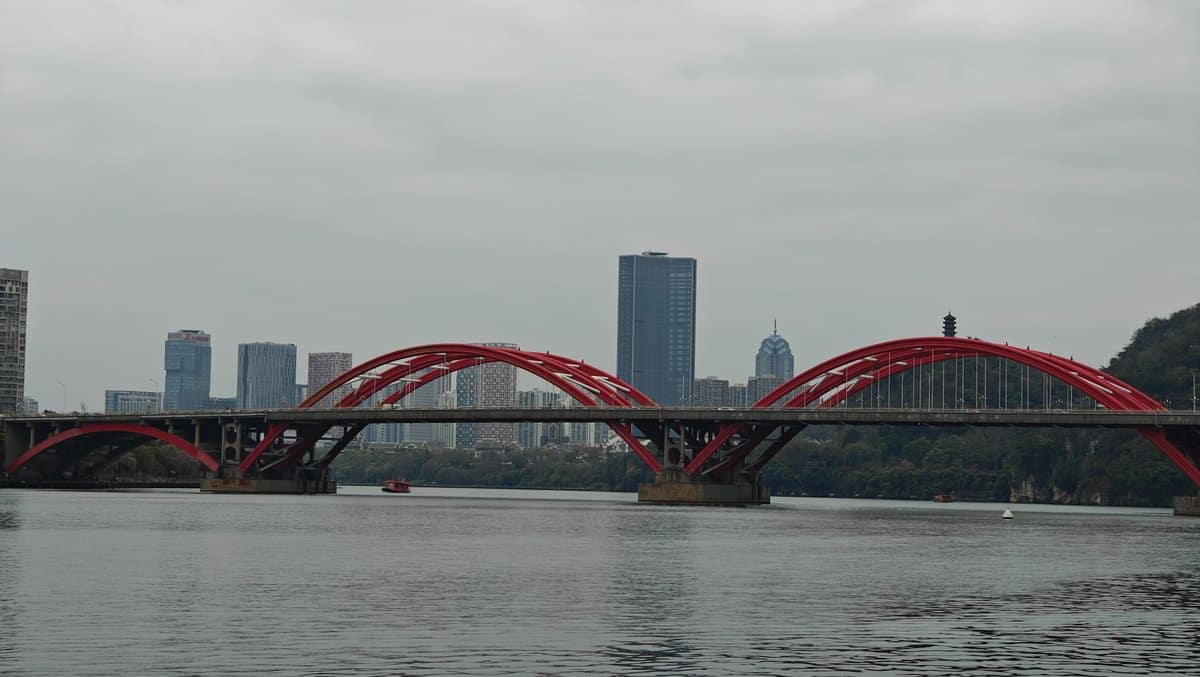 Red bridge full span mountains
