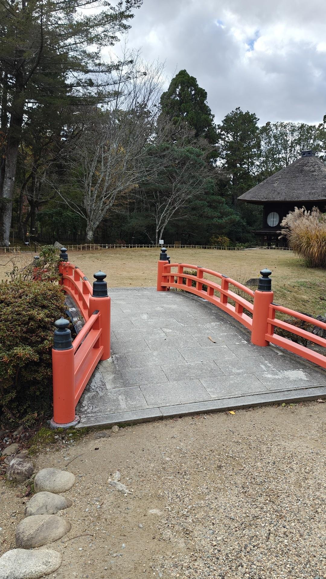 Red bridge in peaceful garden