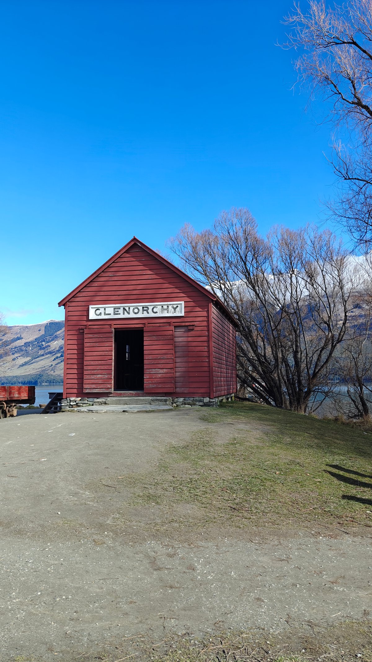 Red GLENORCHY shed on gravel