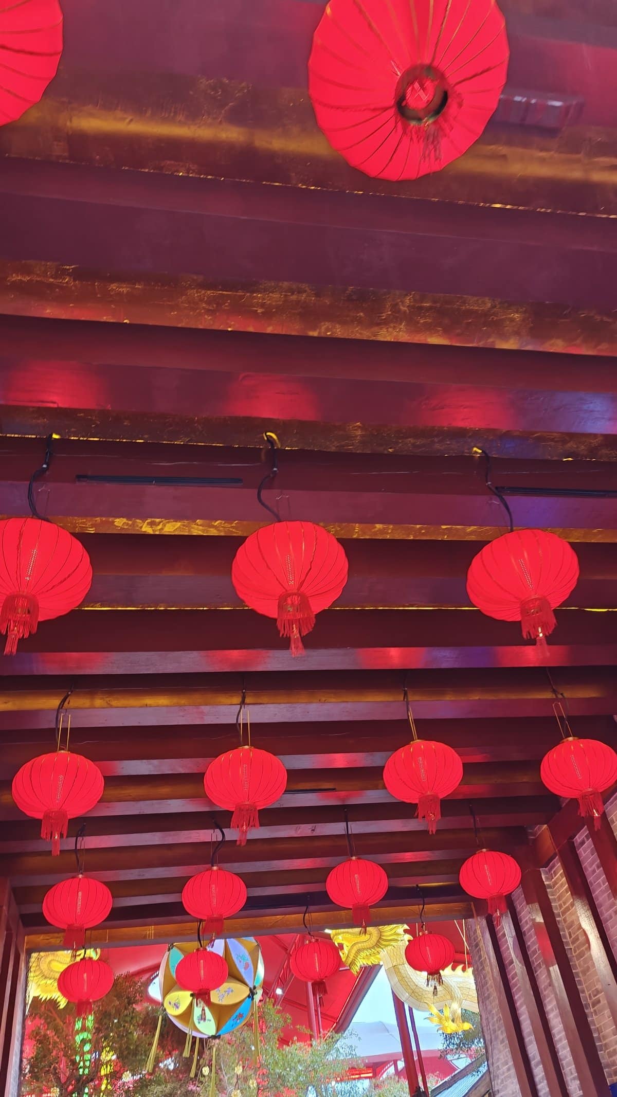 Red lanterns and parasols corridor
