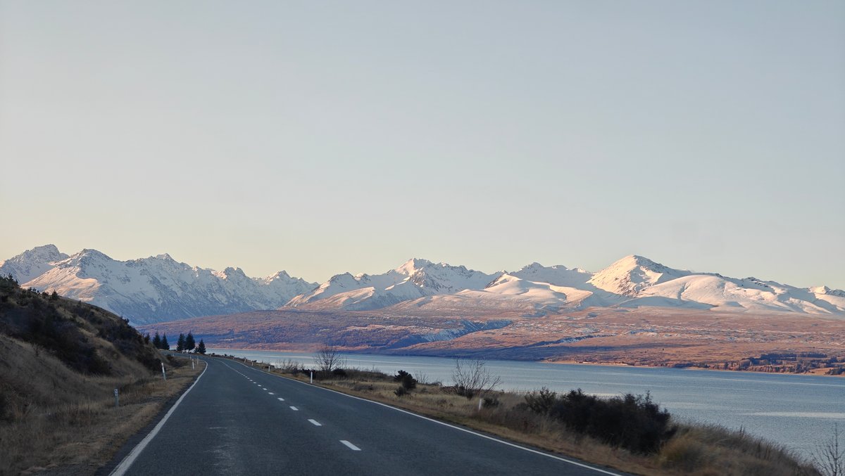 Road along turquoise glacial lake