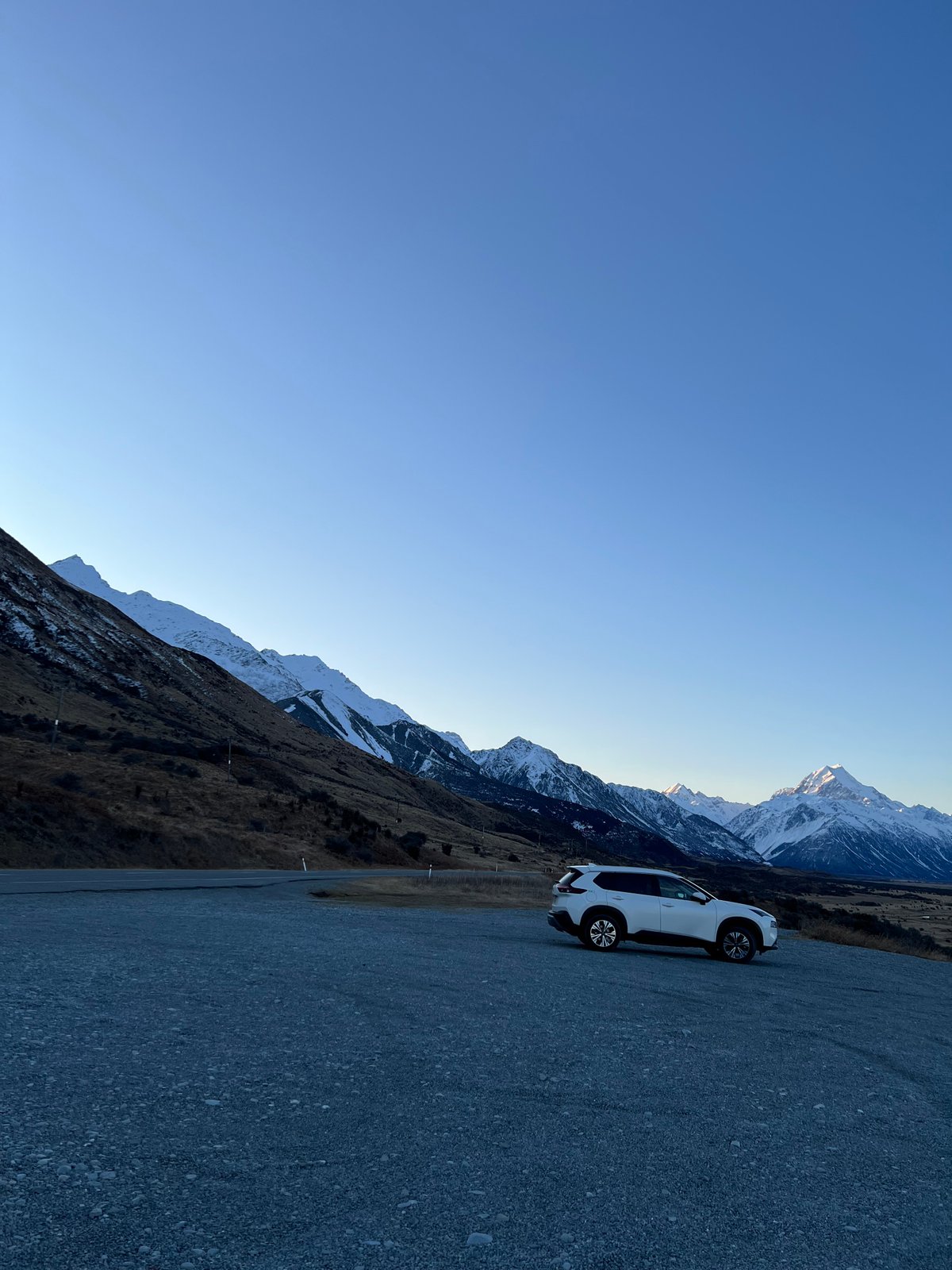 Roadside pullout snow-dusted peaks