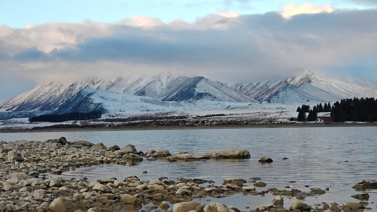 Rocky spit into turquoise Tekapo