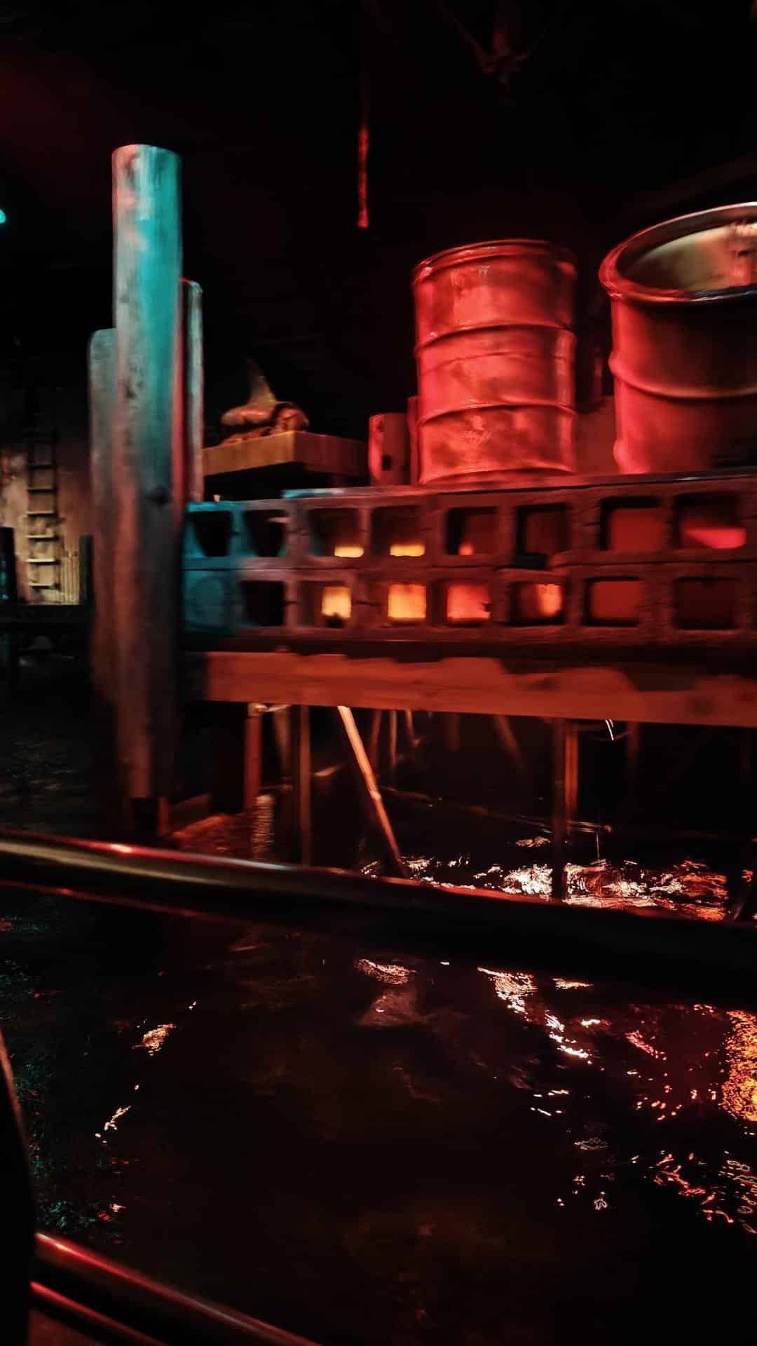 Rustic barrels and beams with red lighting