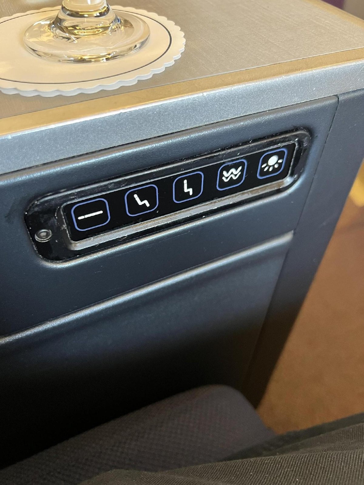 Seat control panel with drink holder