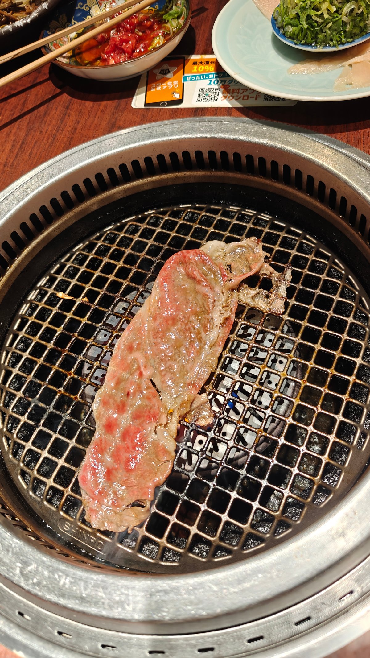 Slice of beef on charcoal grill