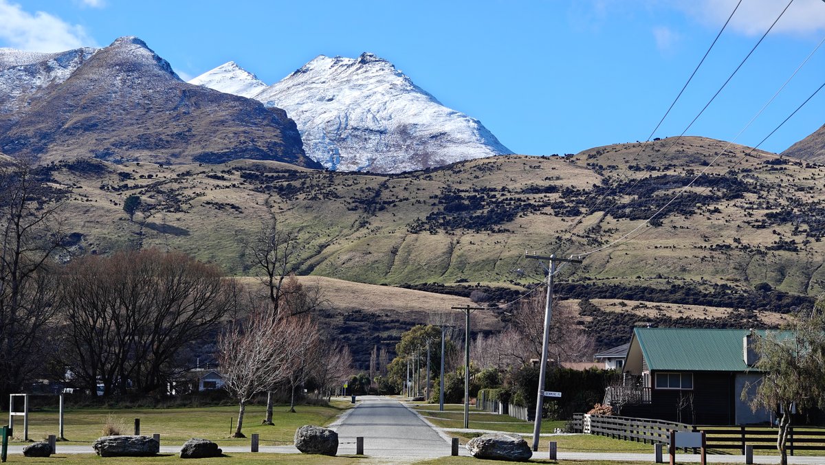 Snow-capped mountains behind the Glenorchy reserve, with a