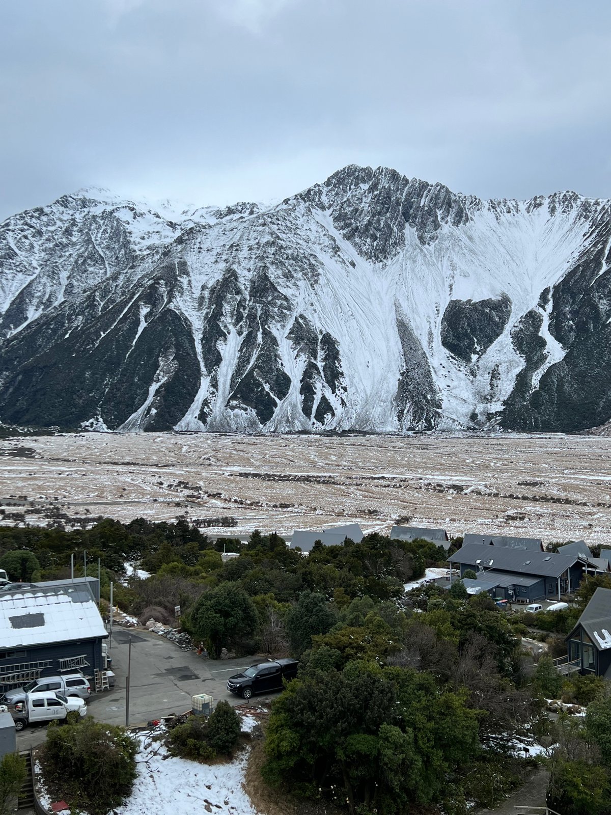 Snow-covered range over village