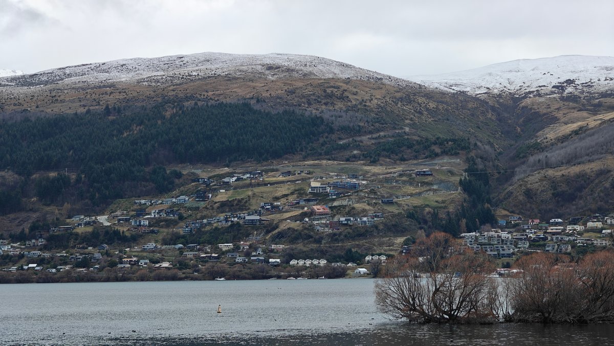 Snow-dusted hills across Lake Wakatipu
