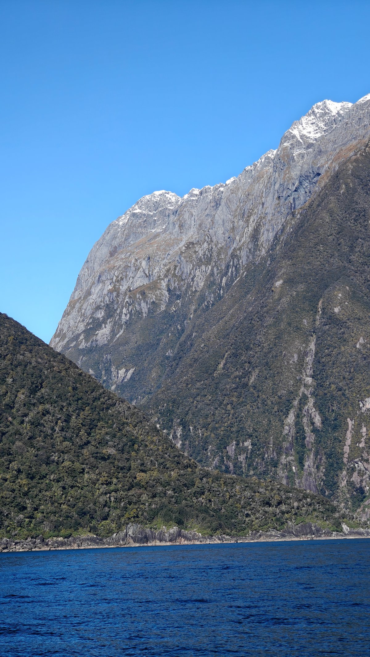 Snow-topped fiord mountain