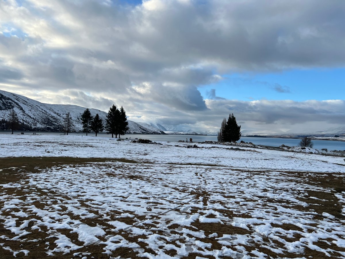 Snowy lakeside tussock flats