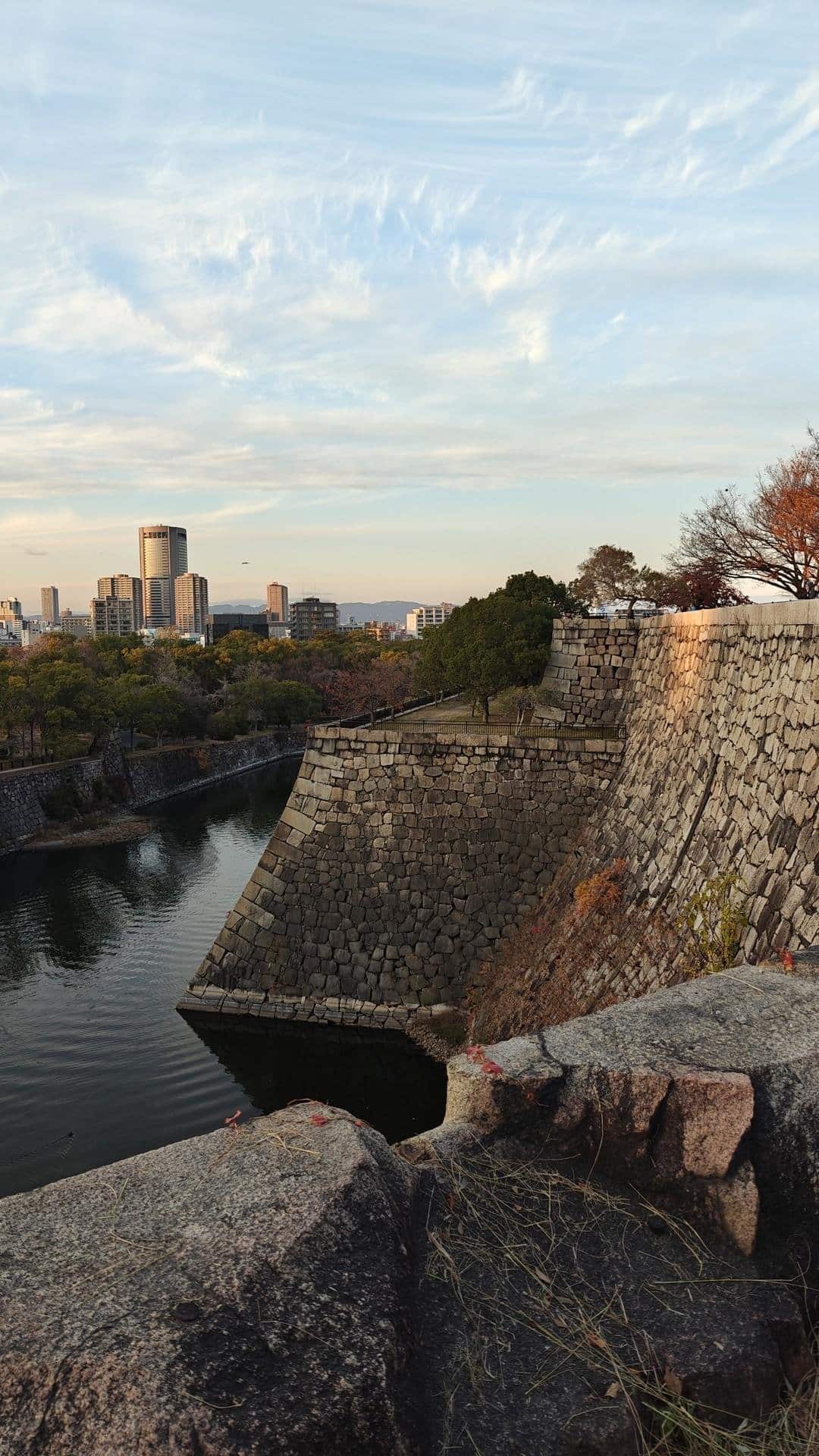 Stone castle wall with city skyline