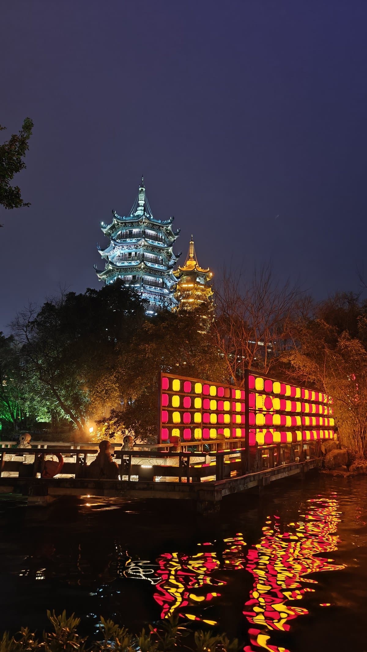 Sun and Moon Pagodas illuminated at night with